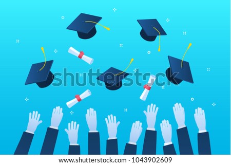 Concept of education. Graduates throwing graduation hats in the air.