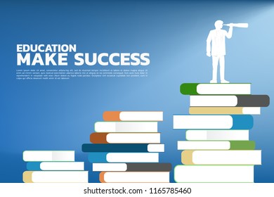 Concept Education make success. Silhouette of businessman looking through telescope standing on stack of books.