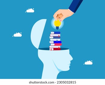 The concept of enhancing learning. A pile of books in a human head with a businessman hand holding a light bulb