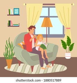 Concept of father and daughter relationships, parenthood. Dad sitting at armchair in living room and combing daughter's hair. Little girl sitting on knees and reading book. Friendship of girl and dad