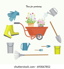 Concept of gardening. Tools for working in garden with colorful flowers 
