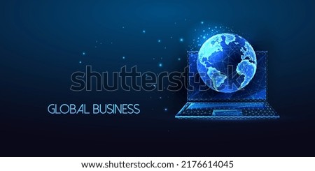 Concept of global business networking with laptop and planet Earth globe in futuristic glowing style