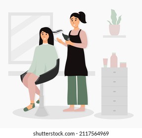 The concept of a hairdressing salon. The girl in the salon. The girl does her hair. A haircut