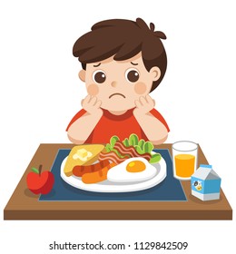 Concept of Health and growing children. Little boy unhappy to eat breakfast.