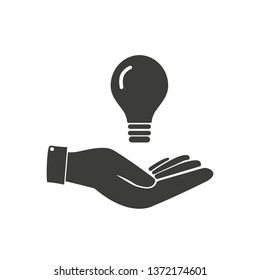 Concept of idea. Light bulb in hand.