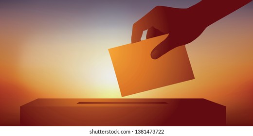 Concept of leadership and democratic election of a candidate with the hand of an elector holding his ballot before slipping it into the ballot box.