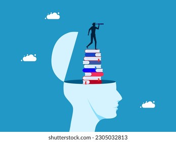 The concept of learning and vision. man with binoculars on stack of books in human head
