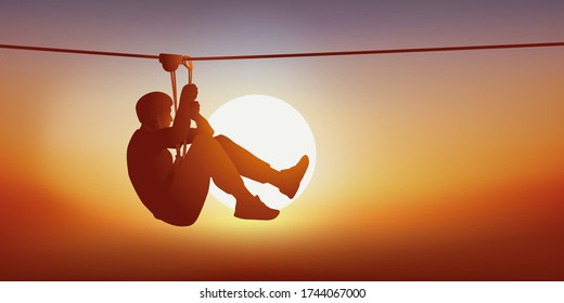 Concept Of Leisure And Outdoor Activities With A Man Looking For Thrills On The Zip Line Of A Tree Climbing Course.