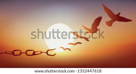 Concept of liberty found, with chains breaking and turning into a dove flying off at sunset. 商業照片 © 