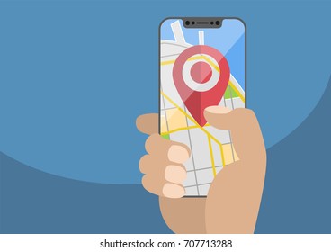 Concept of location / GPS based services on mobile devices. Current location symbol displayed on frameless touchscreen. Hand holding modern bezel-free smartphone,