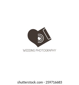 Concept logo of wedding photography. Template of a logo of the photographer in the form of heart with the camera.