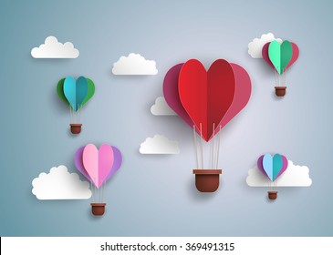 concept of love and valentine day, origami made hot air balloon in a heart shape . paper art and craft style.