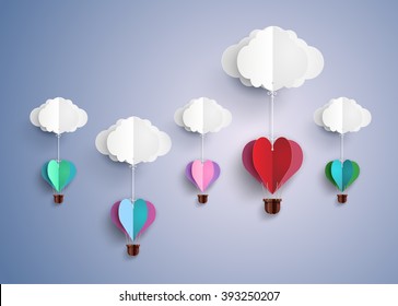 concept of love and valentine day, origami made hot air balloon in a heart shape flying on blue sky. paper art and craft style.