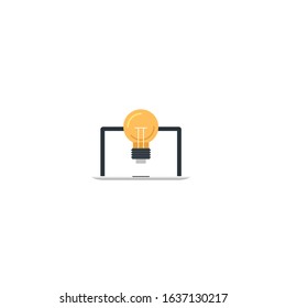 The concept of a new idea. Laptop and old incandescent lamp