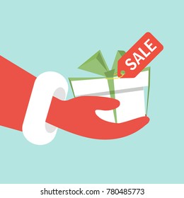 The concept of New Year discounts. Santa's hand offers a discount gift. Holidays and events. Vector illustration in a flat style.