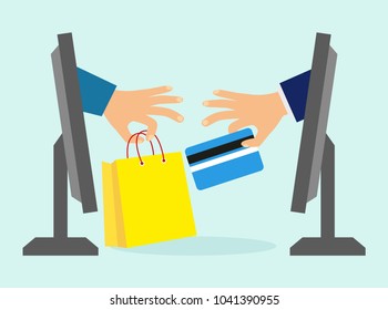 concept of online shopping.  concept of e-commerce ideas. hand with a bank card from the computer monitor. Hand with a bag of computer monitor