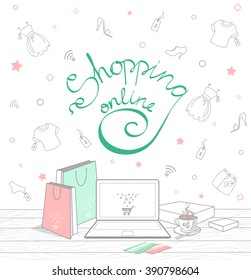 The concept of online shopping with Lettering shopping on-line. Vector illustration. On the table there is notebook, bags, credit cards and a Cup of coffee. Doodle apparel with tags Isolated on white
