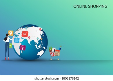 Concept of online shopping, young woman wear a medical face mask and touching the icon of browser to order the goods from the application in a background of globe and route of the shipments.