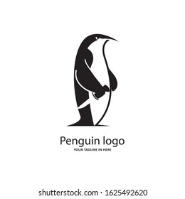 The concept of the penguin logo sports playing tennis or Badminton with a racket, very suitable for the logo of fitness and sports fitness