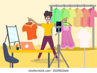 Concept people vlog livestream, lifestyle quarantine. Dark skinned woman wearing glasses going live selling fashion clothes at home, blogger, clothes, dress up and beauty. Vector flat illustration 