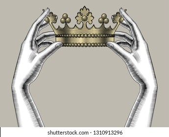 Concept of power and strength. Female hands holding a gold crown. Vintage engraving stylized drawing. Vector illustration