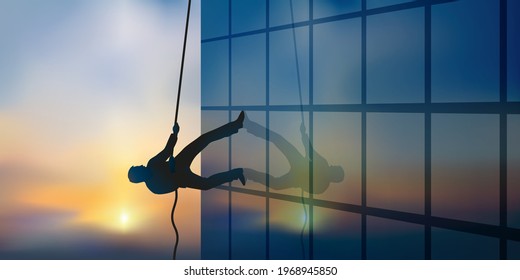 Concept of professional ambition with a man climbing the facade of a building by climbing a rope.