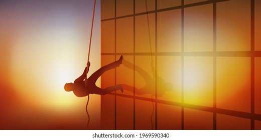 Concept of professional ambition with a man climbing the facade of a building by climbing a rope.