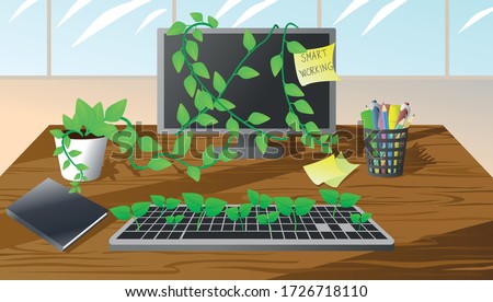 Concept of returning to work after quarantine of covid-19, coronavirus. Office after a long time without workers is abandoned with plants growing on the computer. Normal new.