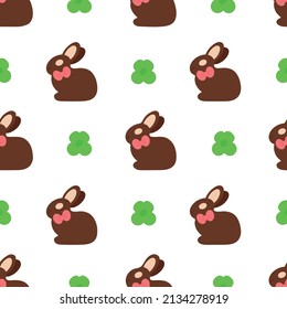 Concept of seamless Easter pattern. Repeating chocolate bunnies and clover on white background. Vector illustration. Easter design element for postcards wrapping paper sites posters banners placards