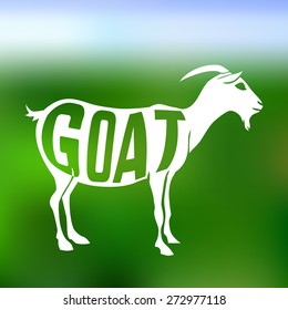 Concept silhouette of  goat with text inside on blur background.