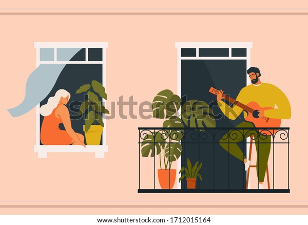 The concept of social isolation during the\
coronavirus pandemic. People playing musical instruments guitar on\
balconies. Stay home quarantine.\
