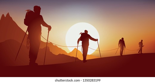 Concept of solidarity, with mountaineers going on an expedition while walking on a ridge of a mountain, before climbing a summit