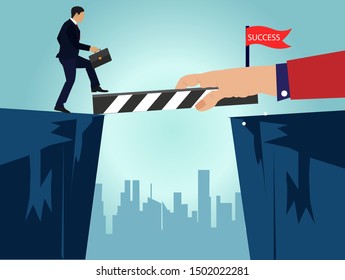 Concept of the solution, with a hand hold a bridge to facilitate the crossing of an obstacle to a businessman and help him achieve his goal.
