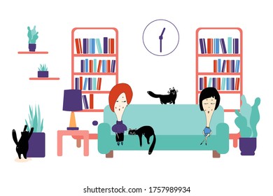 The concept of staying at home.The girl is sitting on the sofa with a friend at a distance. A cat lies between them. Cozy modern Scandinavian interior.Own isolation, quarantine