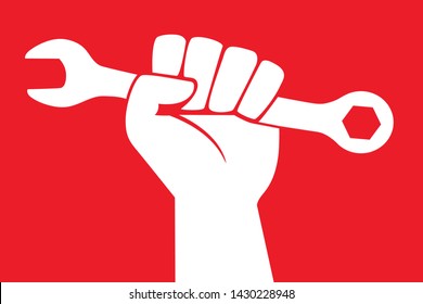 Concept of strike and social demands of the working class, with a raised fist holding a mechanical key, on a red background.