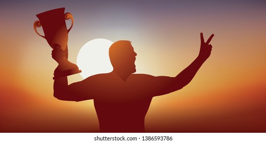 Concept of success with a sportsman enjoying his victory by brandishing the trophy won during a sports competition and by making the sign of victory.
