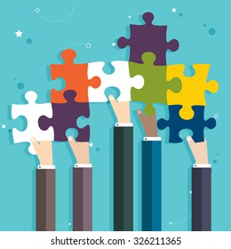 Concept of teamwork and integration with businessman holding colorful puzzle