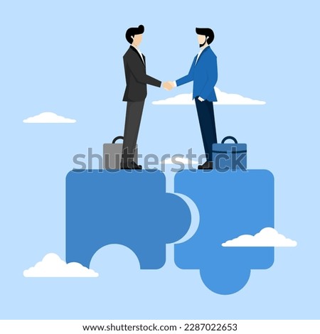 the concept of togetherness or teamwork that supports each other. Successful businessman completing deal and handshake on jigsaw puzzle. cooperation and agreement to help the success of the business.