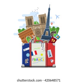 Concept of travel to France or studying French. French flag with landmarks in suitcase. Flat design, vector illustration