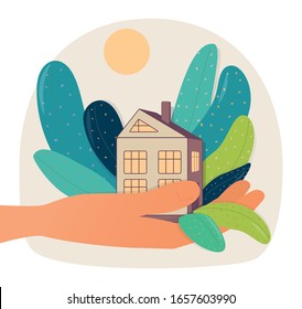 Concept vector illustration of ecohouse with green trees  holding human hand