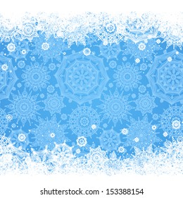 Concept winter frame with snowflakes and place for your text. Light blue background. It can be used for decorating of invitations, greeting cards, decoration for bags.