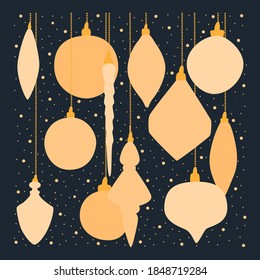 The concept of winter holidays and celebrations. A collection of beautiful decorations for the Christmas tree. Set of holiday decorations. Set of golden hanging toys of the Christmas tree. 