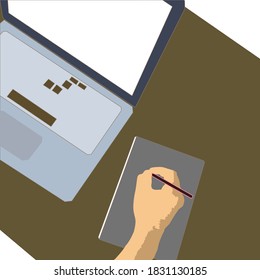 the concept of working in an office. work in front of the laptop. hand holding a pencil to make notes in front of the laptop. modern business concept. work in an office using a computer and notebook.