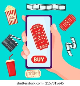 Concepts of online cinema ticket order. Hand holding mobile smart phone with online buy.