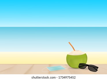 Concepts of taking vacation after coronavirus outbreak. Coconut juice, hygienic mask and an sunglasses on the beautiful sunny beach. 