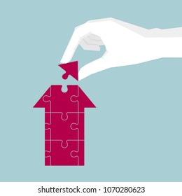 Conceptual design, hand holding puzzles, composition arrow symbol.
