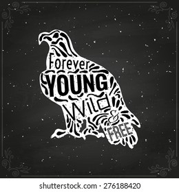 Conceptual eagle with handwritten phrase Forever young, wild and free. Hand drawn tee graphic. Typographic print poster. T shirt design.  Vector illustration on chalkboard.