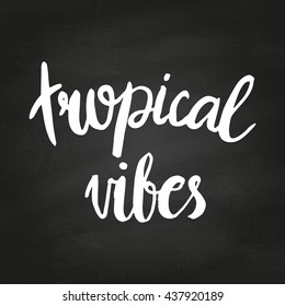 Conceptual hand drawn phrase Tropical vibes on chalkboard. Lettering design for posters, t-shirts, cards, invitations, stickers, banners, advertisement. Vector.