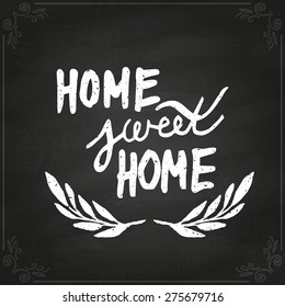 Conceptual handwritten phrase Home Sweet Home. Hand drawn tee graphic. Typographic print poster. T shirt hand lettered calligraphic design. Vector illustration on chalkboard.