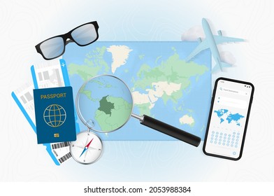 Conceptual illustration of a trip to Colombia with travel gear. World map with compass, passport, tickets, cell phone, plane and glass.
